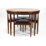 A 1960's Danish teak dining table and set of four chairs, designed by Frem Rojle for Hans Olsen,