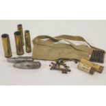 A group of assorted brass ammunition, in the form of spent shell cases and cartridges,