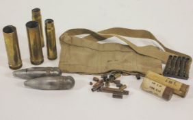 A group of assorted brass ammunition, in the form of spent shell cases and cartridges,