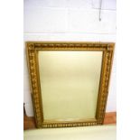 A large wall mirror with gold effect frame,