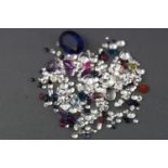 A large collection of loose gemstones to include colourless cubic zirconia,