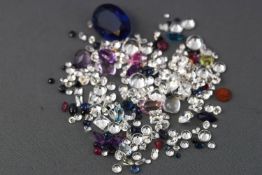 A large collection of loose gemstones to include colourless cubic zirconia,