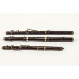 Three hardwood and brass mounted flute mouthpiece end sections,