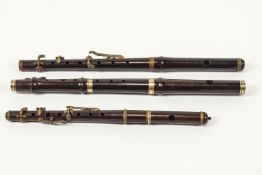 Three hardwood and brass mounted flute mouthpiece end sections,