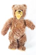 A Steiff Zoty bear, 28cm tall, stud deficent,