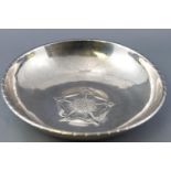 A Keswick Staybrite steel bowl with Tudor Rose centre, signed and marked to the underside,