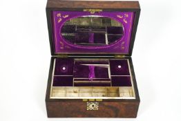 A Victorian walnut and mother of pearl inlaid ladies work box, the interior with mirror inset top,