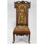 A Victorian mahogany framed nursing chair, with carved scroll crest,