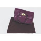 A Mulberry Bayswater type purple leather handbag with dust bag,