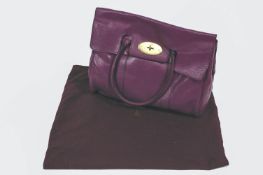 A Mulberry Bayswater type purple leather handbag with dust bag,