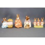 Four Beswick Beatrix Potter figures, 'Hunca Munca Sweeping', 9cm high; 'Hunca Munca', 6.