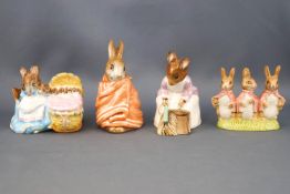 Four Beswick Beatrix Potter figures, 'Hunca Munca Sweeping', 9cm high; 'Hunca Munca', 6.