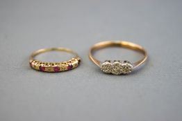 A collection of two dress rings to include: A yellow and white metal illusion set three stone