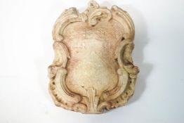 A Rococo style Continental carved marble armorial hatchment, 40cm x 31cm,