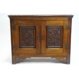 A late 19th century elm side cupboard,