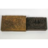 An early 20th century Indian carved hardwood box decorated foliage and another similar,