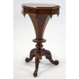 A Victorian mahogany work table, the hexagonal top enclosing fitted interior,