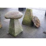 A pair of carved stone staddle stones,