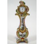A late 19th century Faience Rococo form Boudoir clock, of lyre form with C scroll sides,