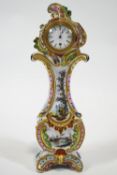 A late 19th century Faience Rococo form Boudoir clock, of lyre form with C scroll sides,