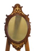 A George II mahogany framed wall mirror, the shaped crest and apron decorated in gilt,