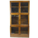 An early 20th Century oak glazed triple bookcase in the Globe Wernicke style,