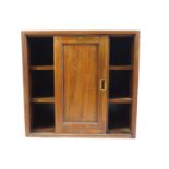 A Victorian mahogany cupboard, fitted two sliding doors enclosing shelves,