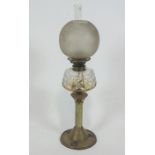 A Victorian brass oil lamp with cut glass reservoir,