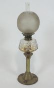 A Victorian brass oil lamp with cut glass reservoir,