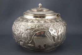 An Indian white metal covered bowl, the bellied body chased and engraved with tigers,