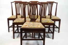 A set of six George III mahogany dining chairs, each with pierced splats,