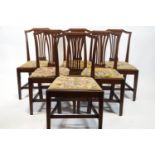 A set of six George III mahogany dining chairs, each with pierced splats,