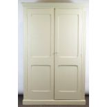 A 19th century painted oak cupboard, with twin panelled doors and fluted uprights,