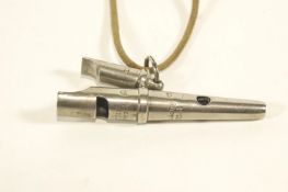 A sheep dogs whistle, playing GDC, stamped ACME Made in England,