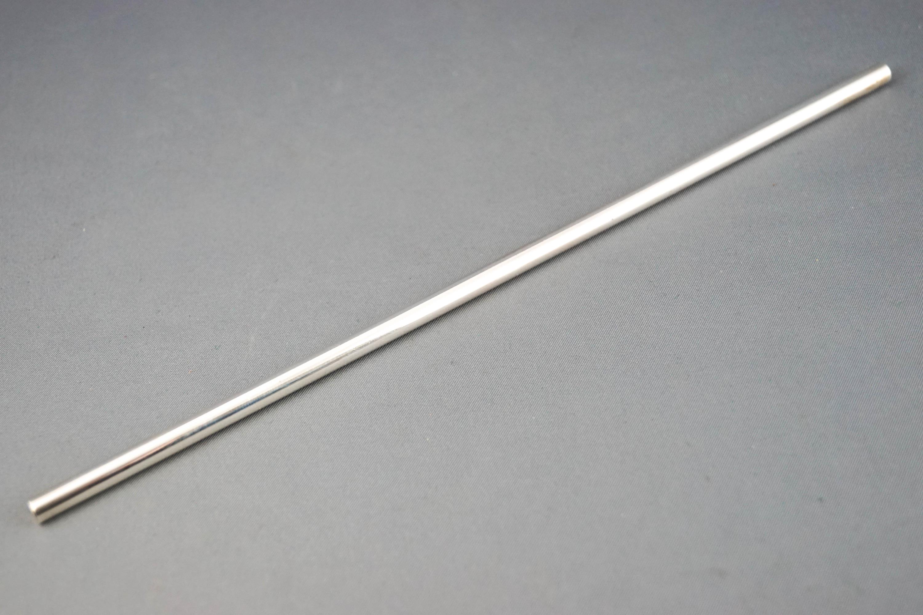 A plain form cylindrical silver straw, London 1993, 23cm high,