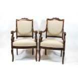 A pair of Regency rosewood library chairs, S scrolled open arms,