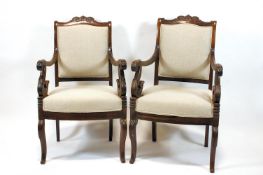 A pair of Regency rosewood library chairs, S scrolled open arms,