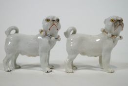 A pair of 19th century Continental porcelain figures of Pugs,