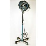 A Retro 1960's floor standing hairdryer, on wheeled stand, converted to an electric lamp,