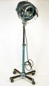 A Retro 1960's floor standing hairdryer, on wheeled stand, converted to an electric lamp,