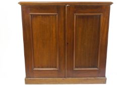 A Victorian mahogany two door cupboard, the twin panelled doors above plinth base,