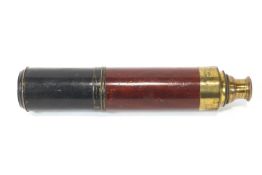 A brass, blackened brass and wood three pull telescope by Clark of Long Acre,