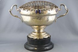 A silver plated two handled rose bowl on a plinth, of Art Nouveau form with a spot hammered finish,