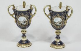 A pair of 1979 Coalport boxed limited edition three handled fine bone china vases,