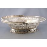 An oval silver swing handled cake basket, of traditional form,