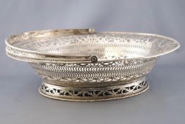 An oval silver swing handled cake basket, of traditional form,