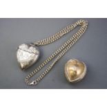 A large silver heart shaped vesta, decorated with foliate scroll engraving, Birmingham 1897, 6cm,