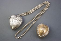 A large silver heart shaped vesta, decorated with foliate scroll engraving, Birmingham 1897, 6cm,