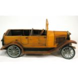 A wooden scale model of a Volvo OV4 car,