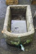 A carved stone trough,